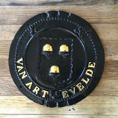Restauratie en vergulden in 24k bladgoud van het wapenschild