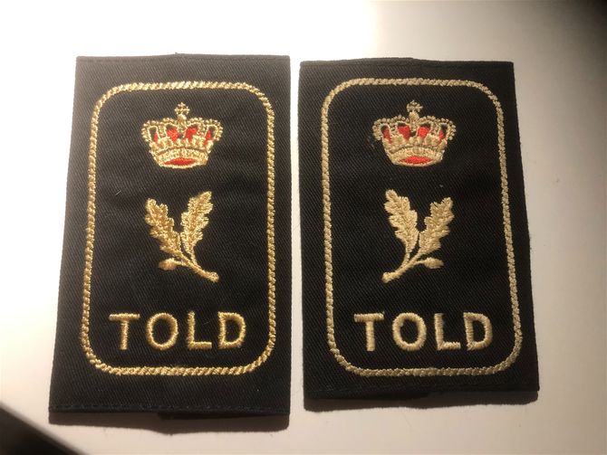 Axelklaffar Tull Danmark.