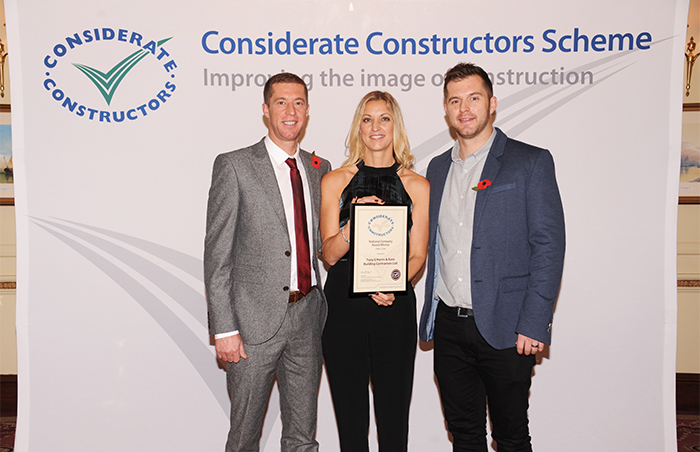 TGH & Sons team collecting a Considerate Constructors Scheme award