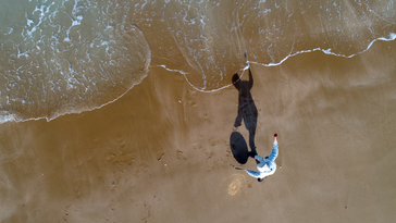 DRONE SHOT OF GONG MASTER STRIKES