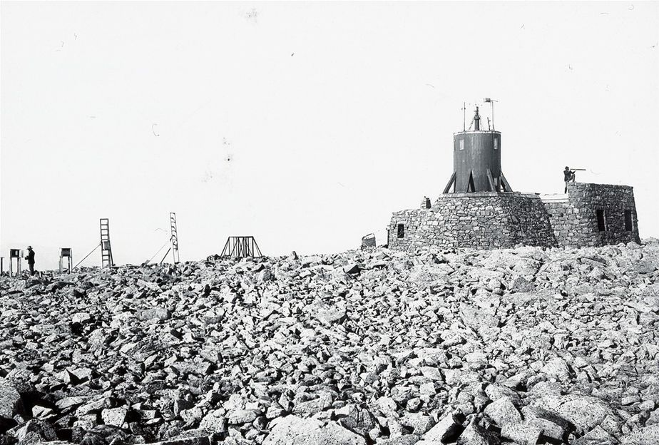 The Ben Nevis Observatory, with readings being taken, and a man on the look-out. A photograph by GW Wilson.