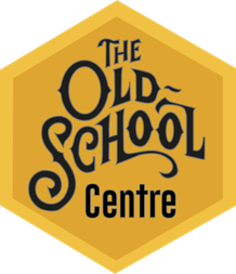 Yellow hexagon with black, old-fashioned text saying The Old School Centre