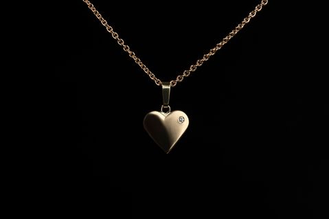 Handmade heart in yellow gold with diamond