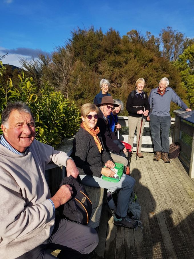 Happy trampers enjoying a lovely view