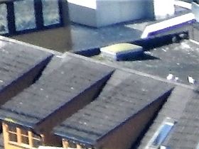 Hotell CC Winn Tromsö sett från ovan; byggnaden i fronten med sin speciella arkitektur med en mast i framkant är Hotell Scandic Tromsö