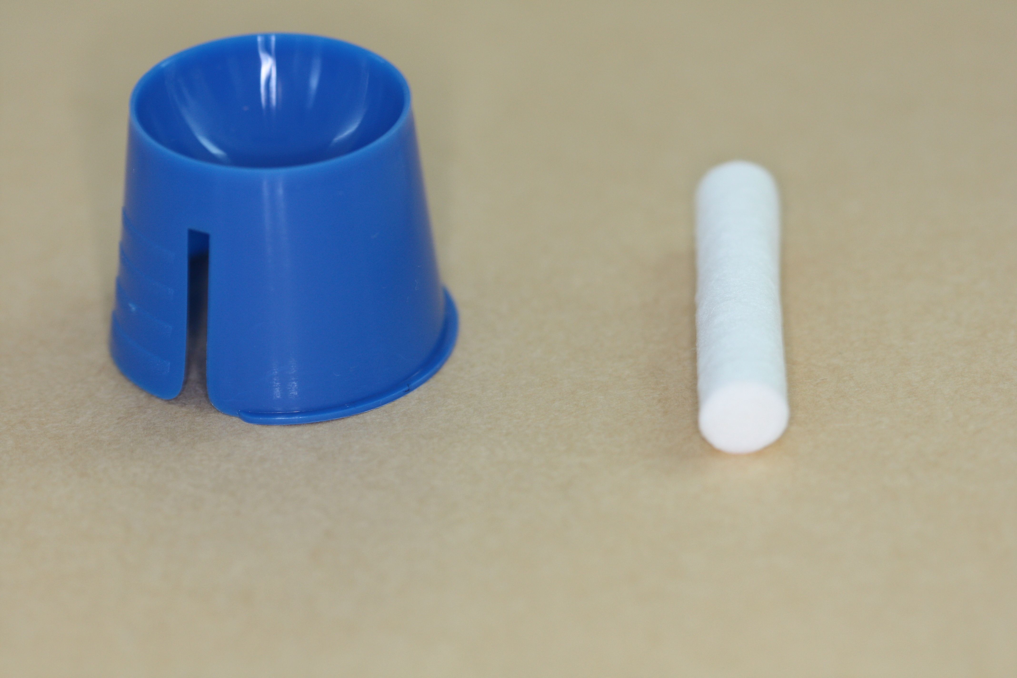 2 - Pot and cotton wool roll for numbing gel