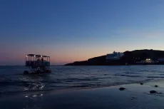 MC 19 082 - Bigbury sea tractor - a-boat-is-on-the-water-at-sunset