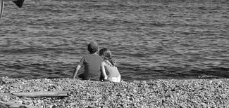 MC 20 115 - Innocent in cornwall - a-man-and-a-woman-sitting-on-a-beac