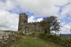 MC 21 152 - brentor - a-stone-building-on-a-hill-with-a-tree-in-the-fo