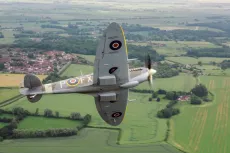 Aerolegends Spitfire Flight - a-small-plane-flying-over-a-