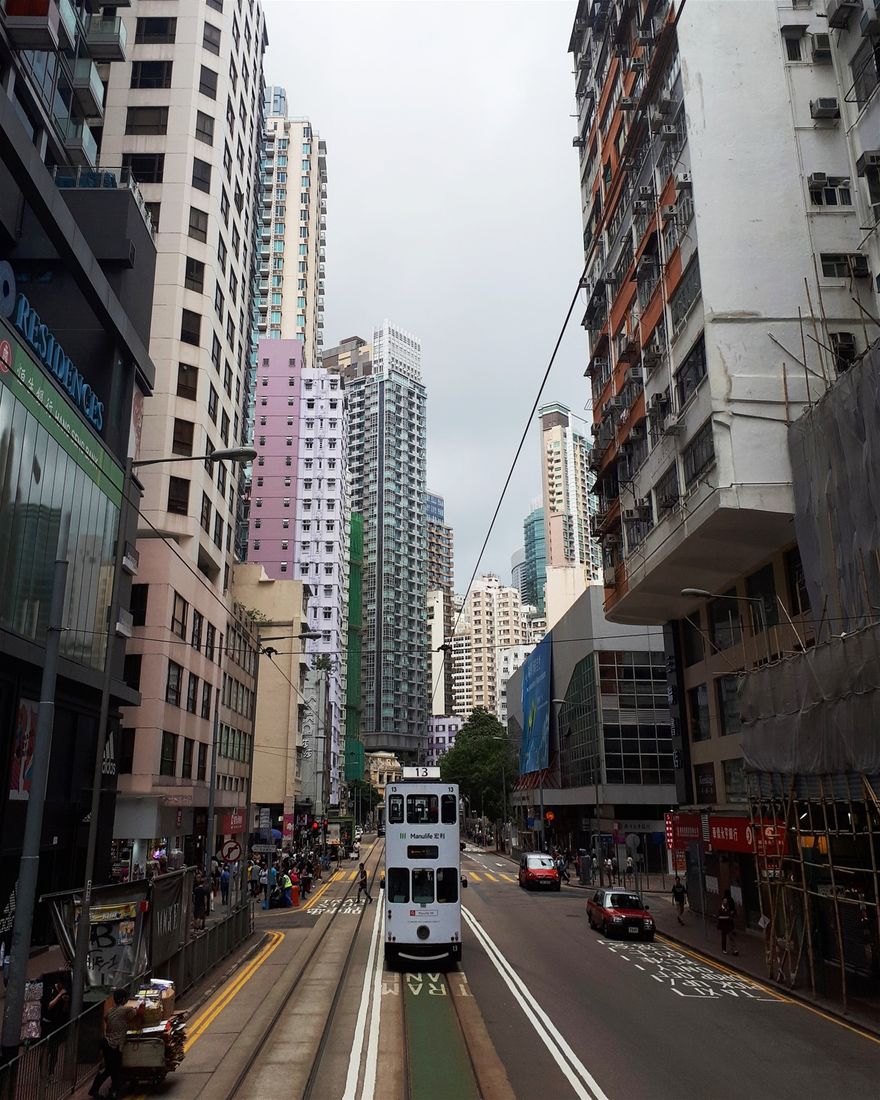 View of a tram from the back of a tram.