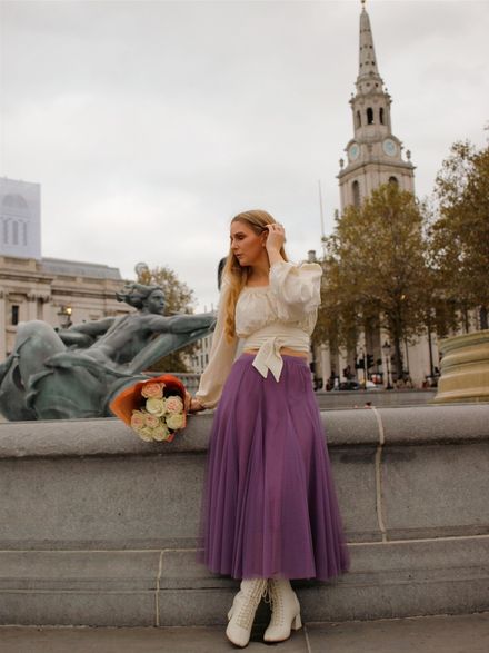 This little blouse is so pretty and versatile. https://www.chicwish.com/pearly-neck-tie-back-embossed-crop-top-in-cream.html