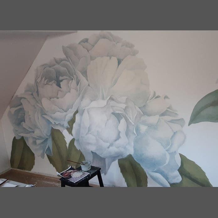 Whitening the flowers. The pink color subtely shines through.